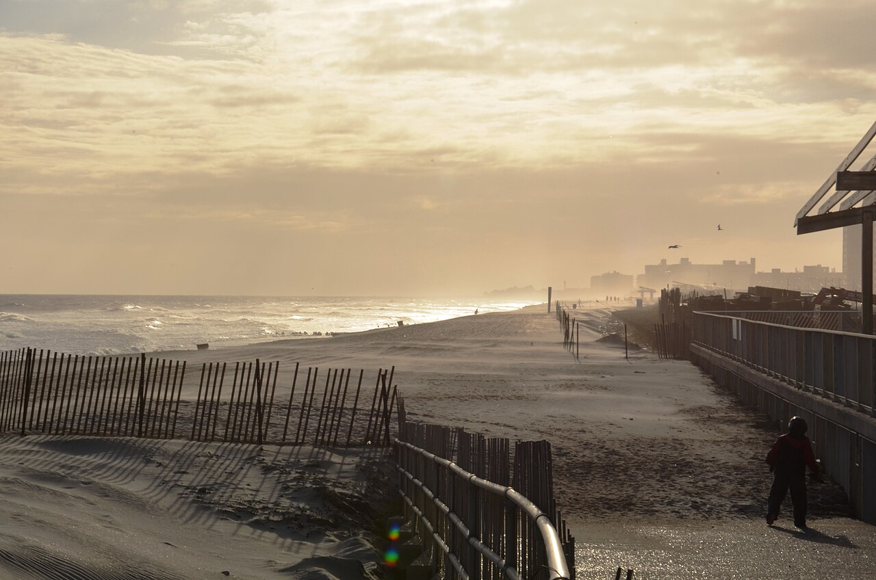 The Rockaway Beach boardwalk and sand with the Atlantic Ocean beyond